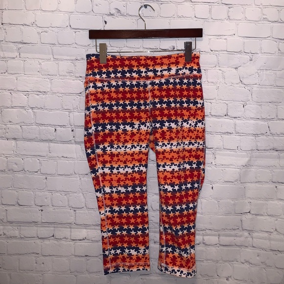 Reebok Pants - Reebok Orange & White Star leggings size M